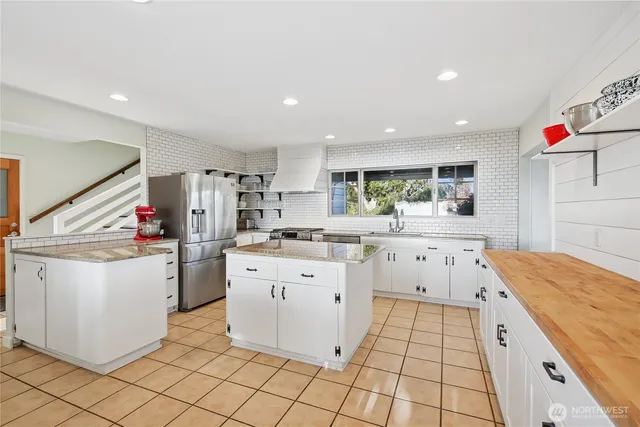 a kitchen with a white cabinets and white appliances