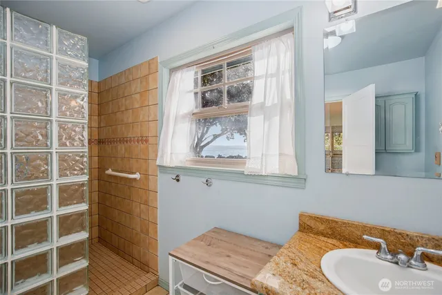 a bathroom with a sink and a mirror