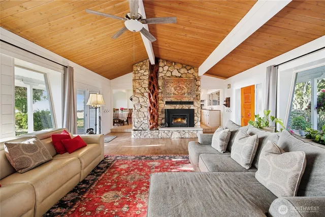 a living room with furniture fireplace and a table