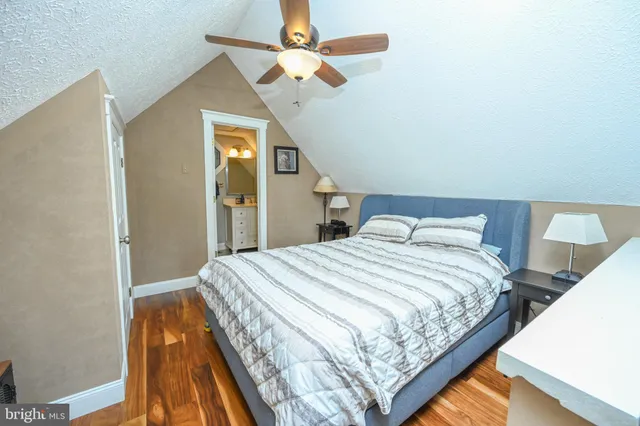 a bedroom with bed and window