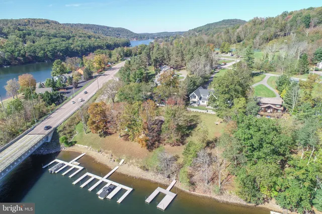 an aerial view of mountain with yard swimming pool and mountain view