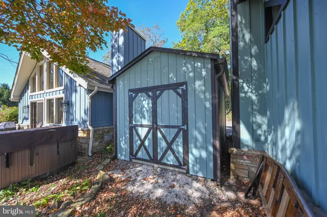 a backyard of a house with outdoor seating