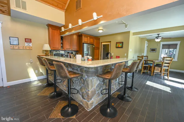 a view of a dining room with furniture and wooden floor