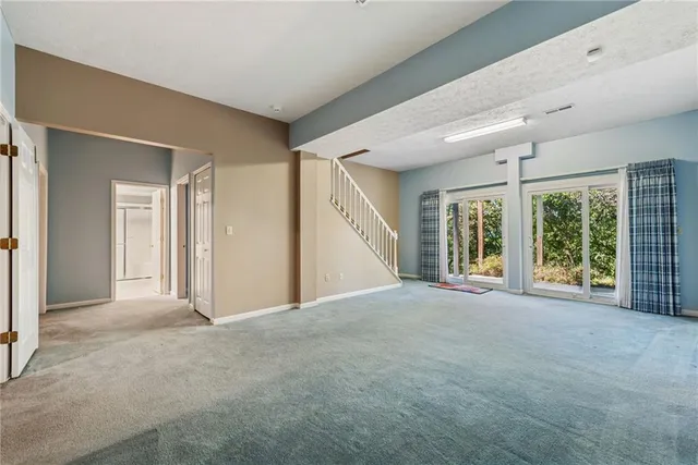 a view of an empty room with windows