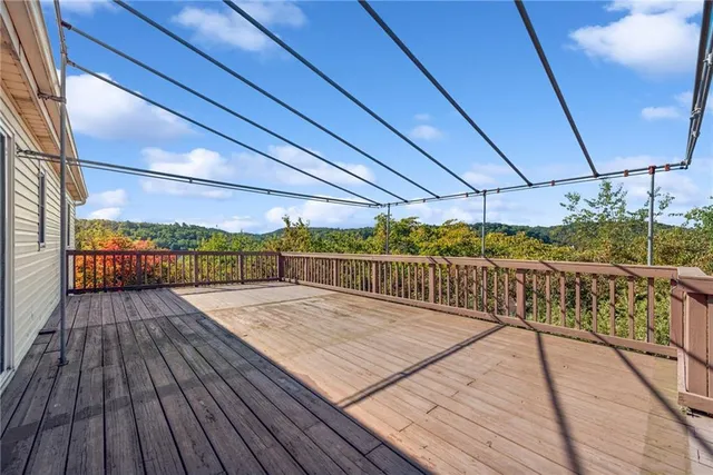 a view of balcony with wooden floor