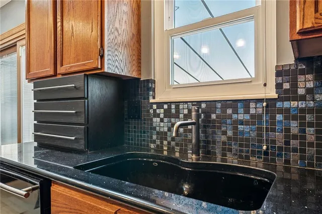 a bathroom with a sink a mirror and a bathtub