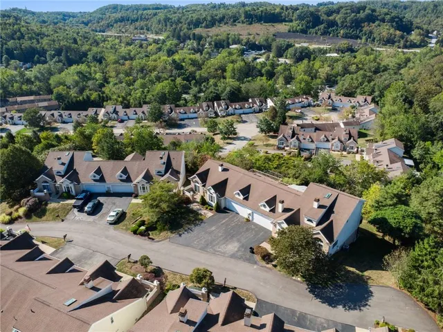an aerial view of a house with a garden
