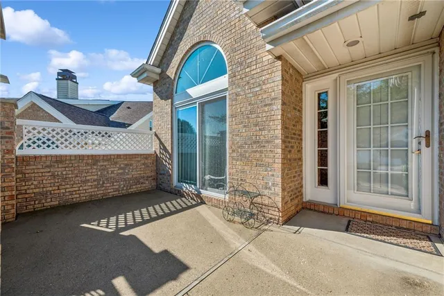a view of a brick house with a large windows
