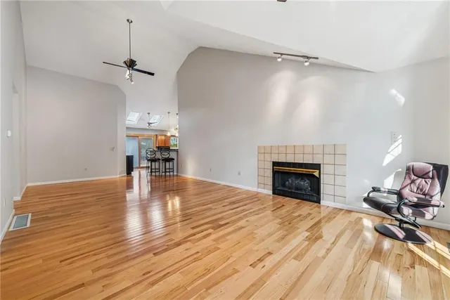 a view of livingroom with hardwood floor and a fireplace
