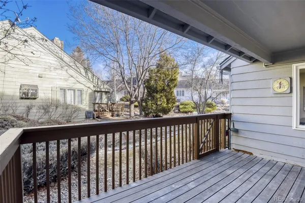 a view of a balcony with wooden floor
