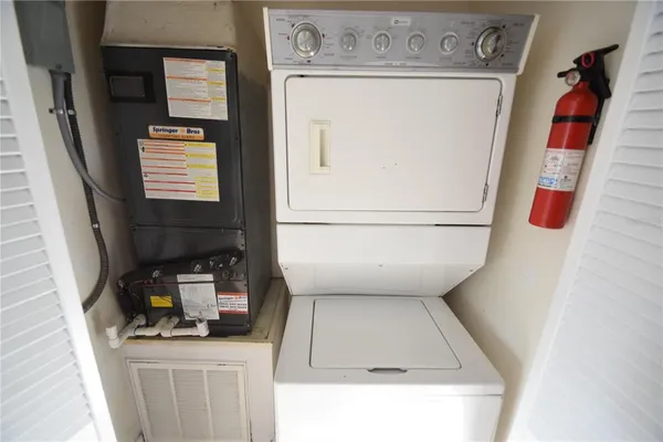 a hallway with washer and dryer