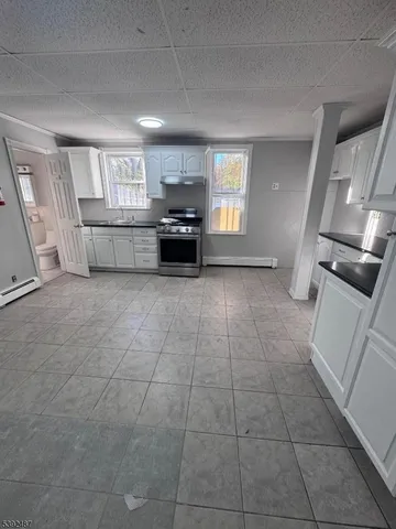 a view of a kitchen with furniture and windows