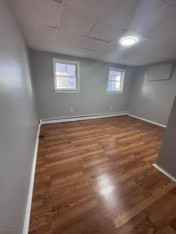 a bathroom with a sink toilet and window