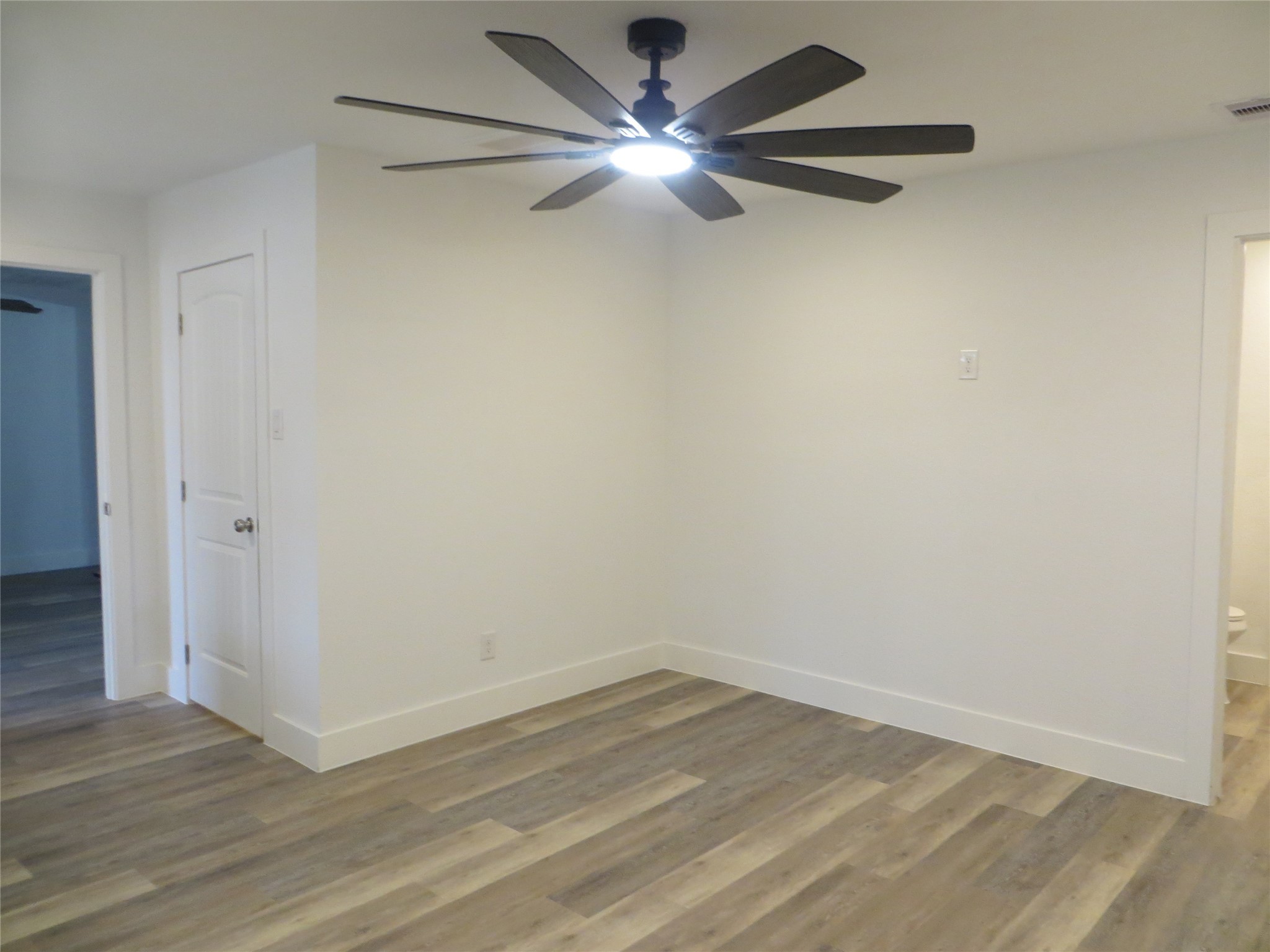 2910 Rose Street Pasadena, TX 77503 - Photo 12 of 18 wooden floor in an empty room