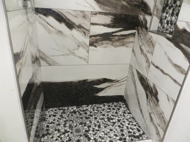 a bathroom with a sink and a shower