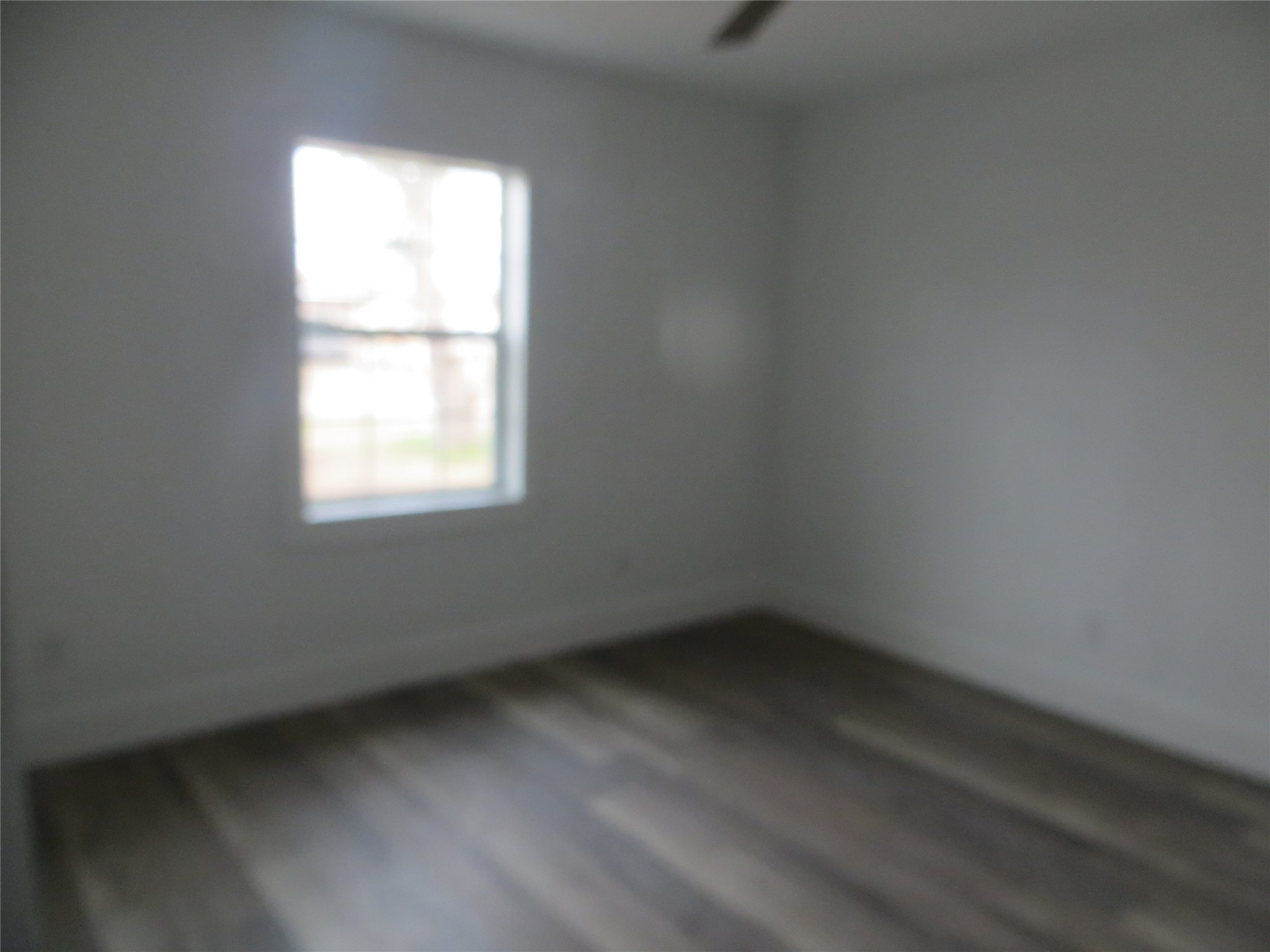 2910 Rose Street Pasadena, TX 77503 - Photo 9 of 18 an empty room with a window