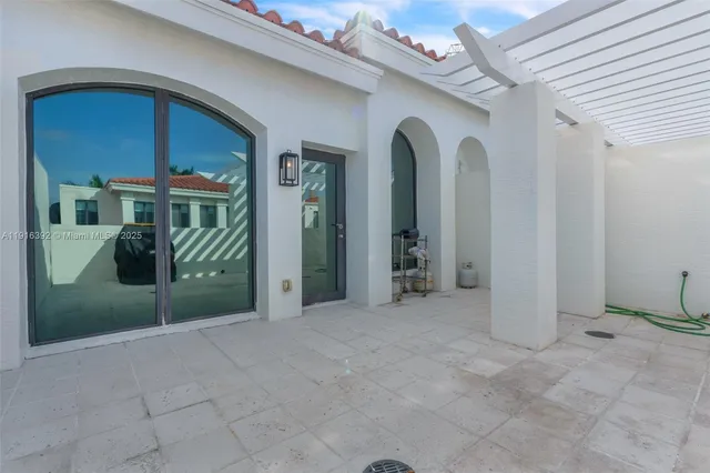 a kitchen with stainless steel appliances granite countertop a stove a microwave and a sink