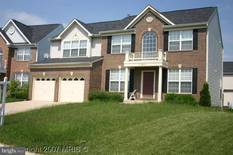 17903 Coachmans Road Germantown, MD 20874 - Photo 2 of 2 a front view of a house with a yard and garage