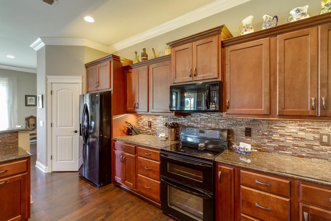 4680 Sango Road Clarksville, TN 37043 - Photo 11 of 29 a kitchen with granite countertop a refrigerator stove and sink