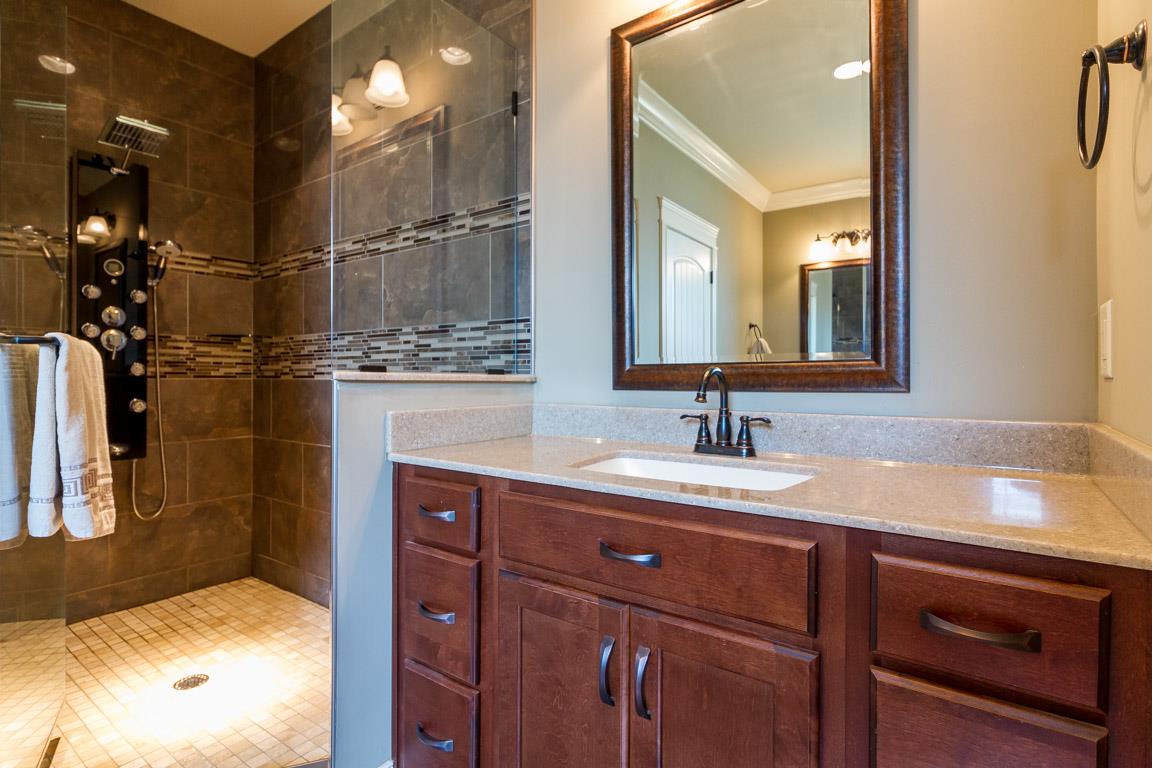 4680 Sango Road Clarksville, TN 37043 - Photo 16 of 29 a bathroom with a sink and a mirror