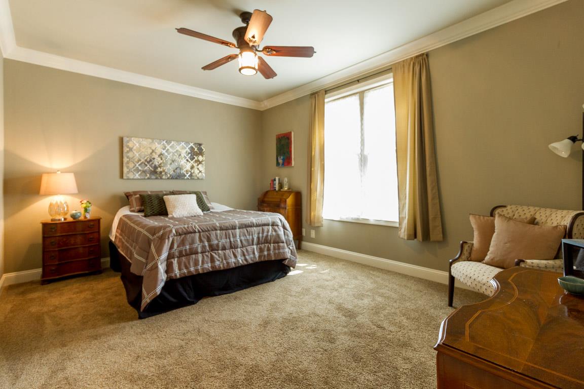4680 Sango Road Clarksville, TN 37043 - Photo 20 of 29 a bedroom with a bed couch and window