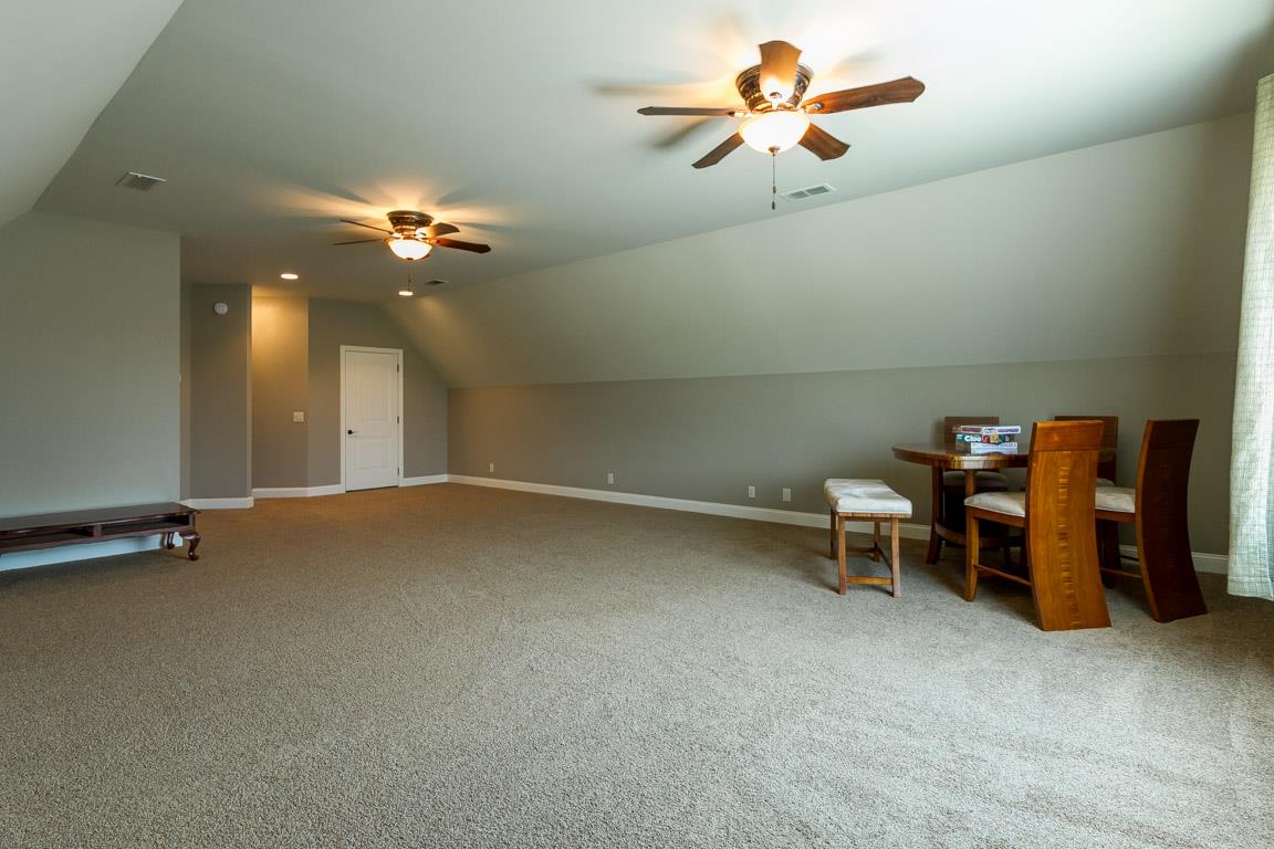 4680 Sango Road Clarksville, TN 37043 - Photo 23 of 29 wooden floor in a hall with a chandelier
