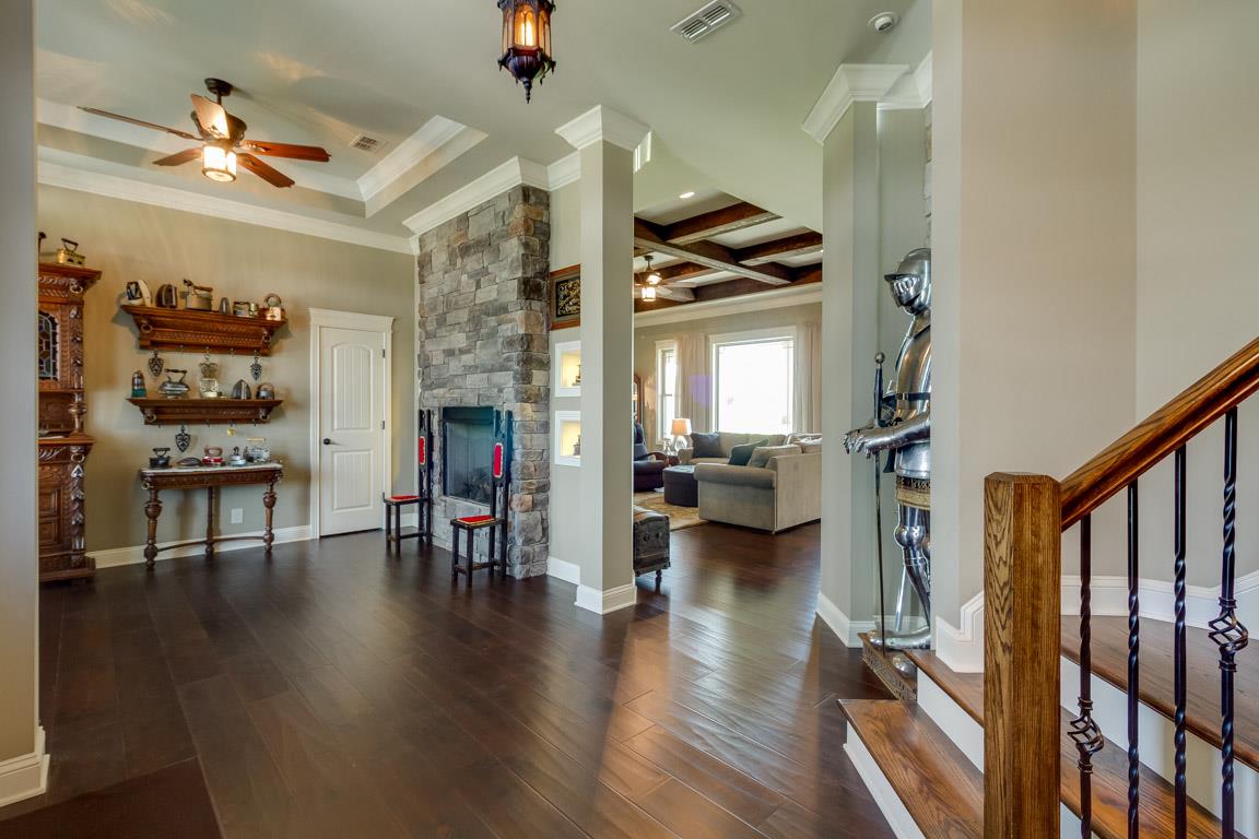 4680 Sango Road Clarksville, TN 37043 - Photo 5 of 29 a living room with furniture or wooden floor and a fireplace