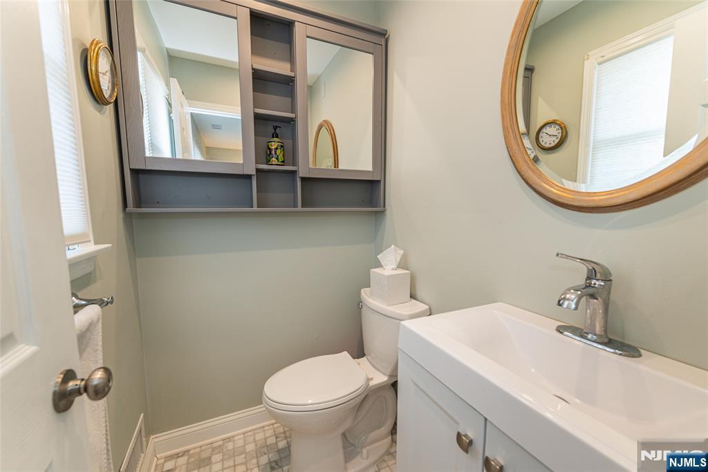 271 Collignon Way, Unit 8B River Vale, NJ 07675 - Photo 17 of 26 a bathroom with a sink and a mirror
