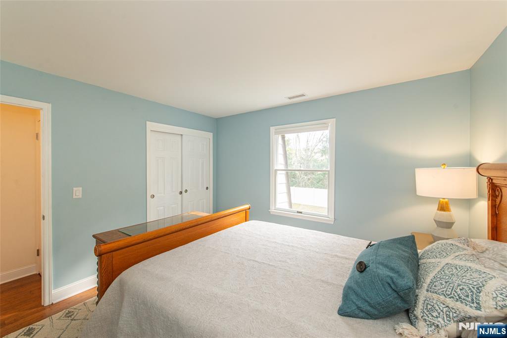 271 Collignon Way, Unit 8B River Vale, NJ 07675 - Photo 21 of 26 a bedroom with a bed and a window