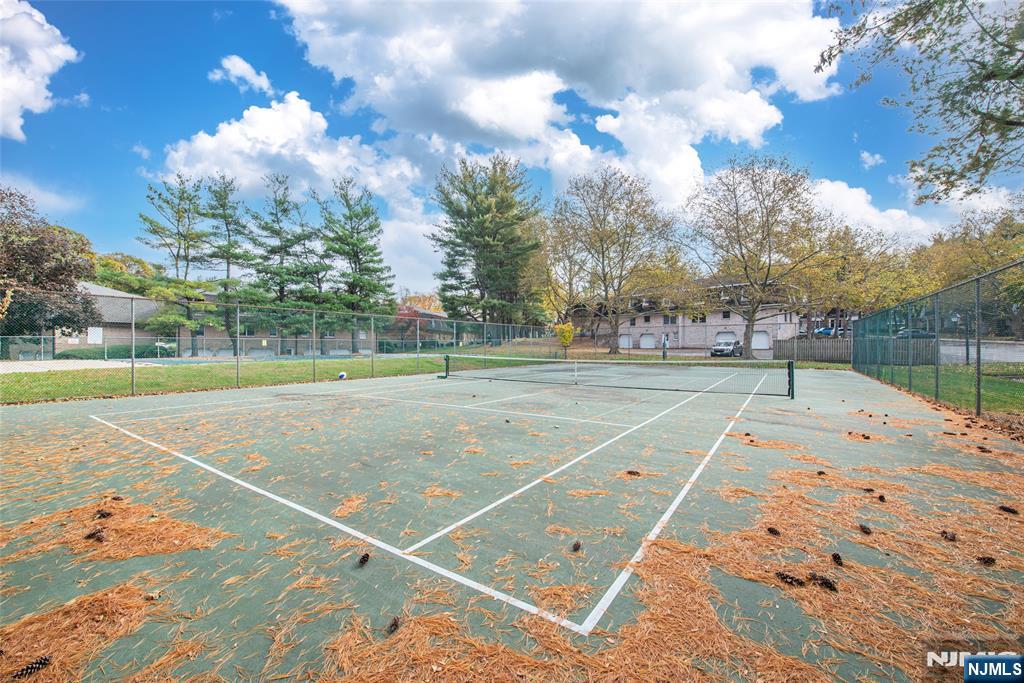 271 Collignon Way, Unit 8B River Vale, NJ 07675 - Photo 23 of 26 a view of a tennis court