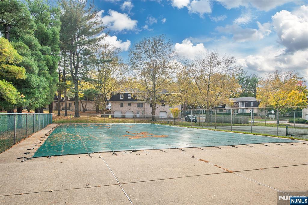 271 Collignon Way, Unit 8B River Vale, NJ 07675 - Photo 24 of 26 a view of a fountain in the park next to a lake