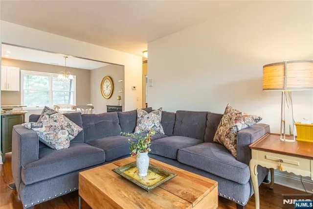 a living room with furniture rug and window