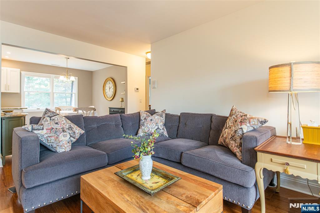 271 Collignon Way, Unit 8B River Vale, NJ 07675 - Photo 3 of 26 a living room with furniture rug and window