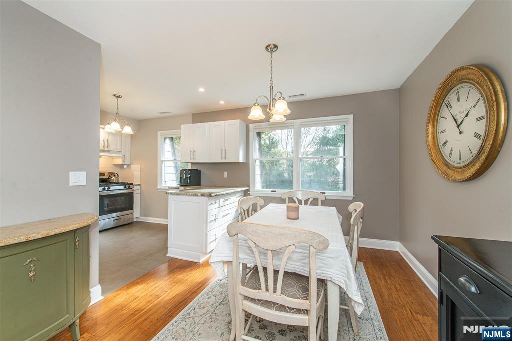271 Collignon Way, Unit 8B River Vale, NJ 07675 - Photo 9 of 26 a view of a dining room with furniture window and wooden floor