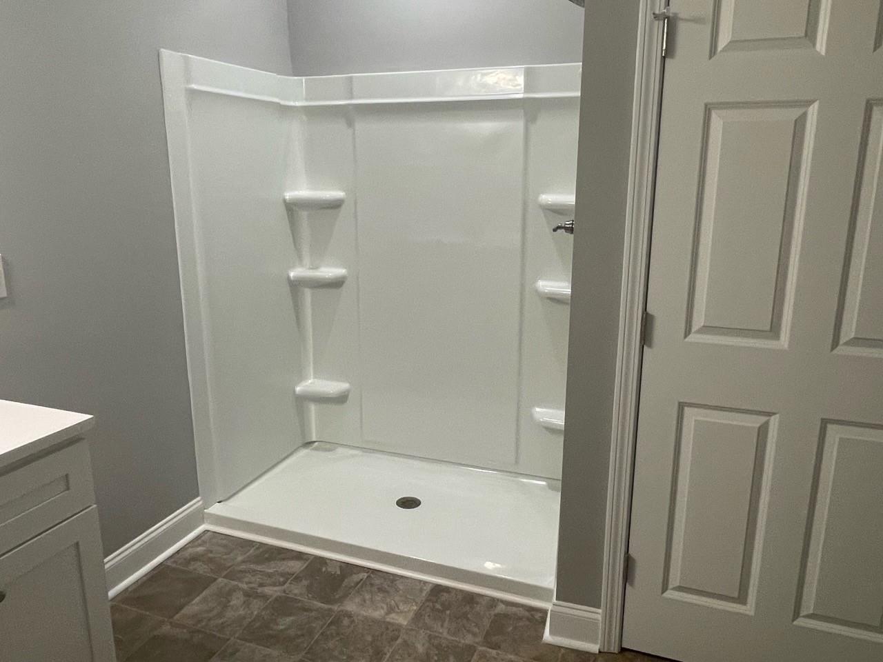 2001 Barkley Circle Monroe, NC 28112 - Photo 15 of 20 a bathroom with a tub and shower