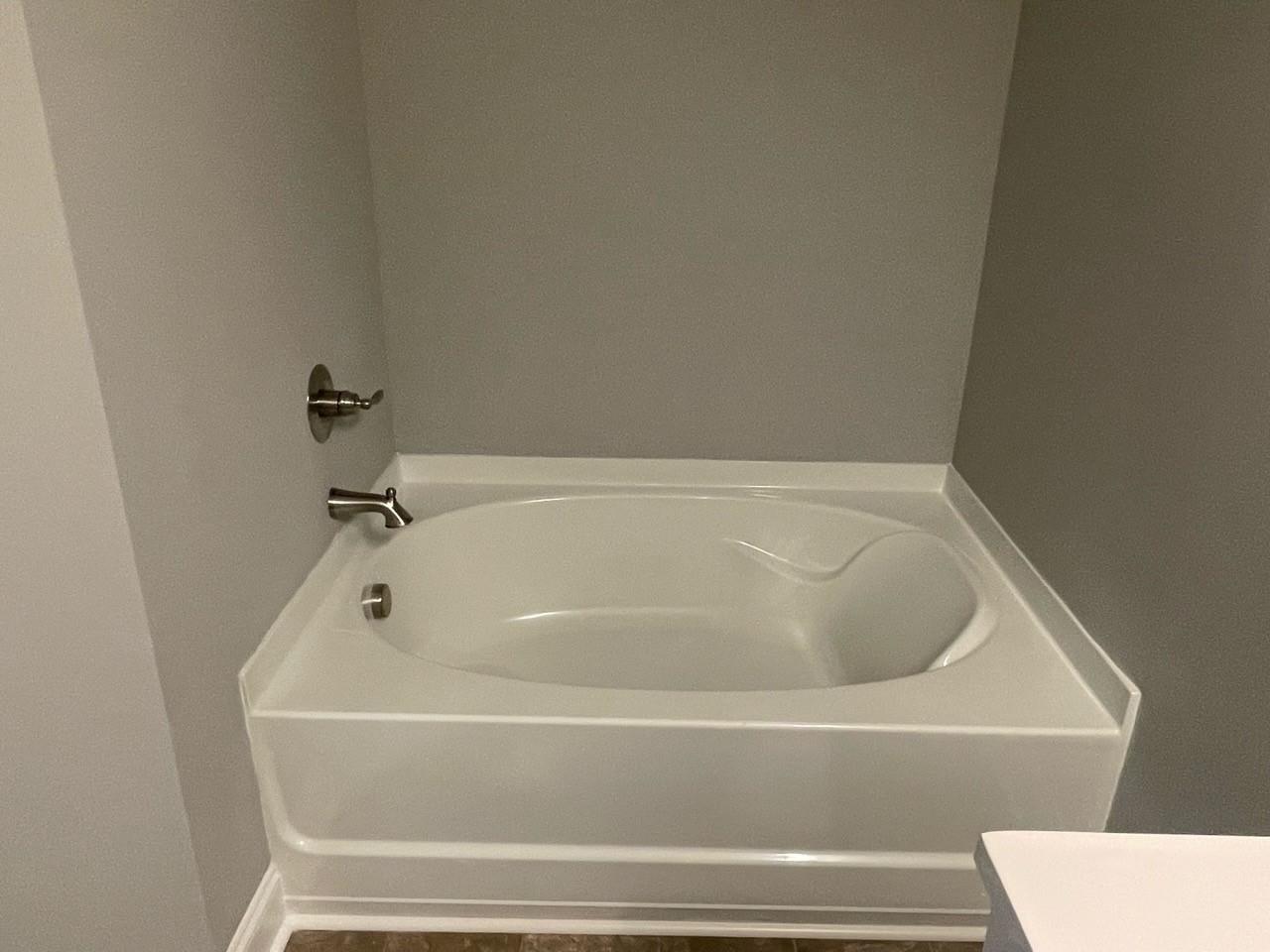 2001 Barkley Circle Monroe, NC 28112 - Photo 19 of 20 a bathroom with a bathtub