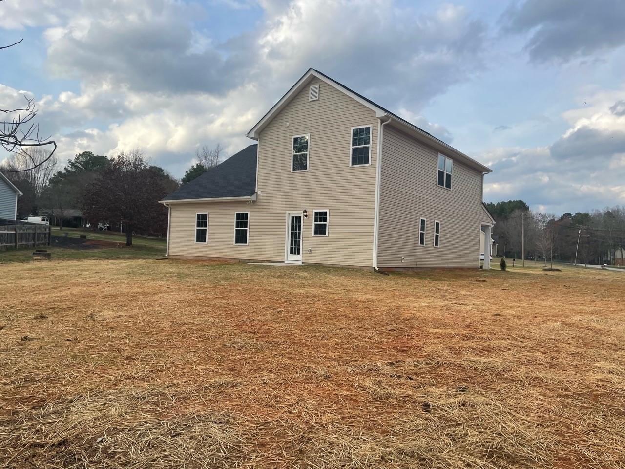 2001 Barkley Circle Monroe, NC 28112 - Photo 3 of 20 a view of a house with backyard and garden