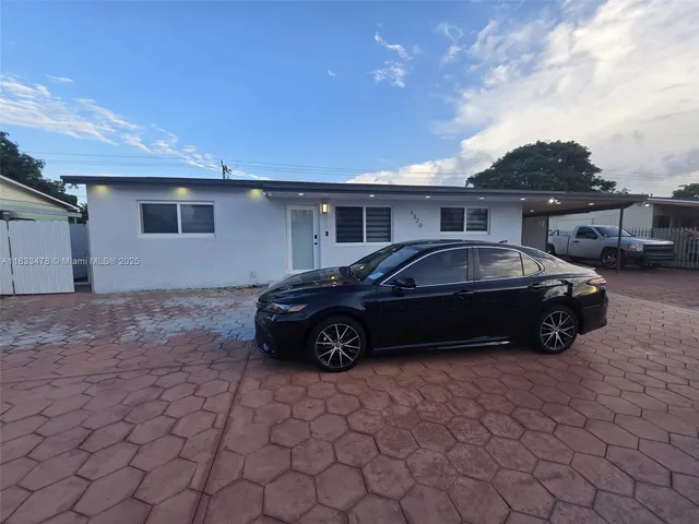 a car parked in front of a house