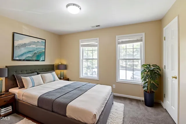 a bedroom with bed and a window