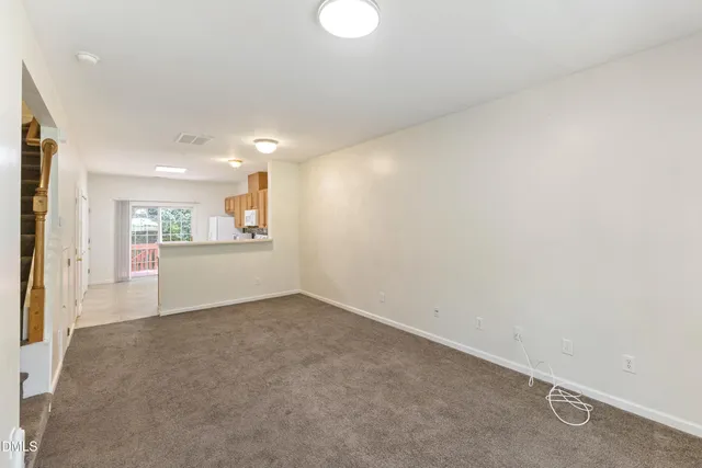 a view of a kitchen with a sink and cabinets
