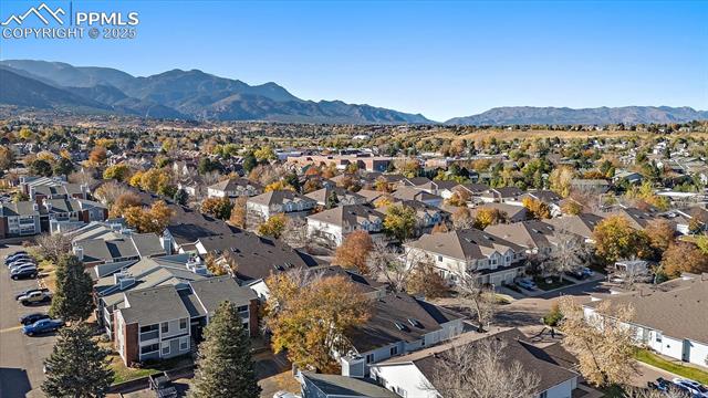 1110 Samuel Point Colorado Springs, CO 80906 - Photo 28 of 28 Aerial view of property's location with a mountain backdrop and nearby suburban area