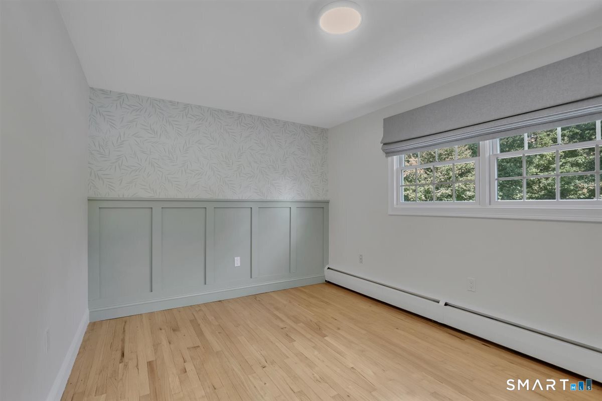 361 Miles Road Orange, CT 06477 - Photo 17 of 40 Second bedroom on this level, also with hardwood flooring.