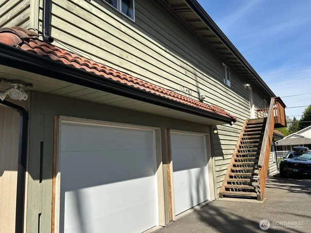a front view of a house with a garage