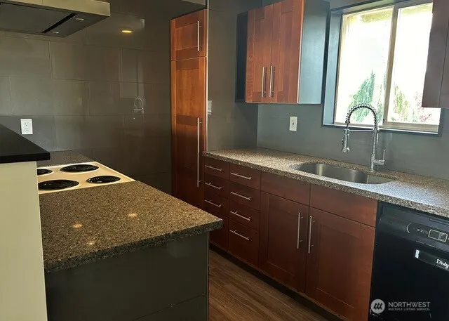 a kitchen with a sink and a window