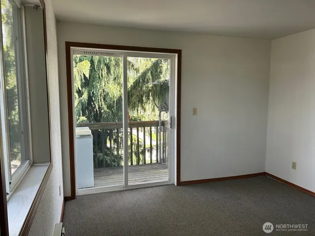 a view of a room with a large window