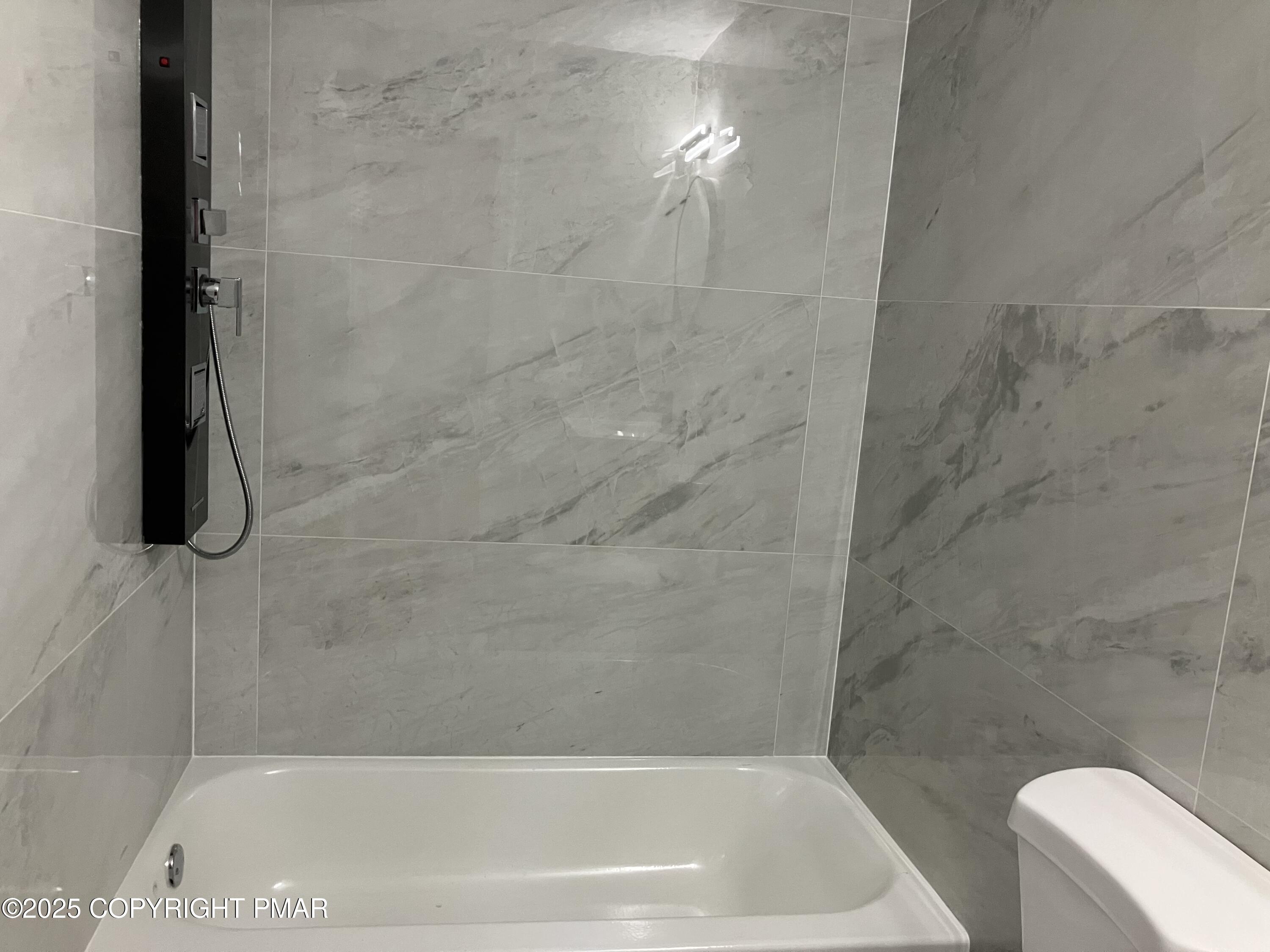 2096 Scarborough Way Bushkill, PA 18324 - Photo 13 of 38 a bath tub sitting next to a white toilet and vanity