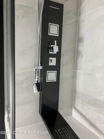 a view of a small space with wooden floor and a window