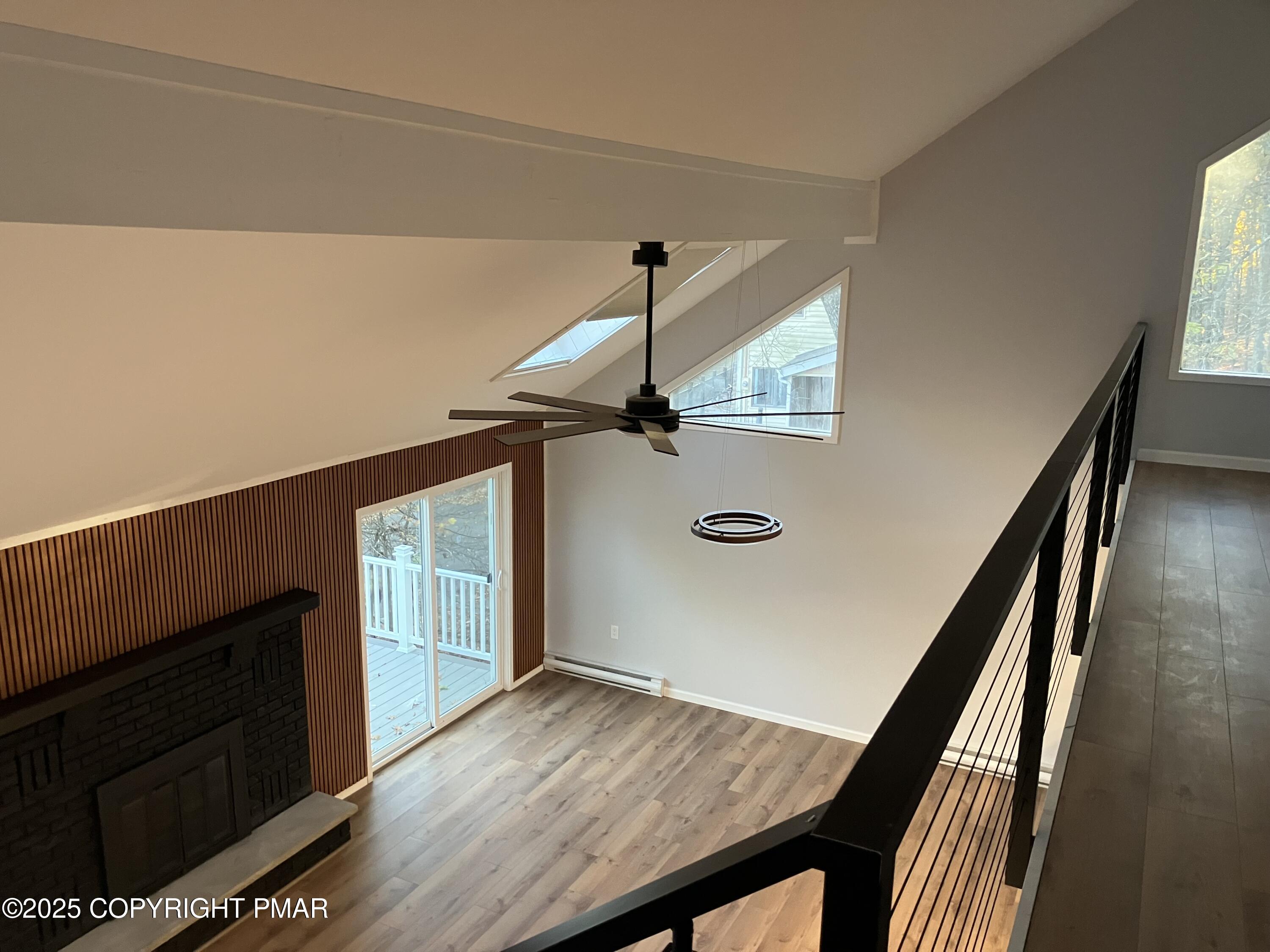 2096 Scarborough Way Bushkill, PA 18324 - Photo 17 of 38 a view of a hallway with wooden floor and staircase
