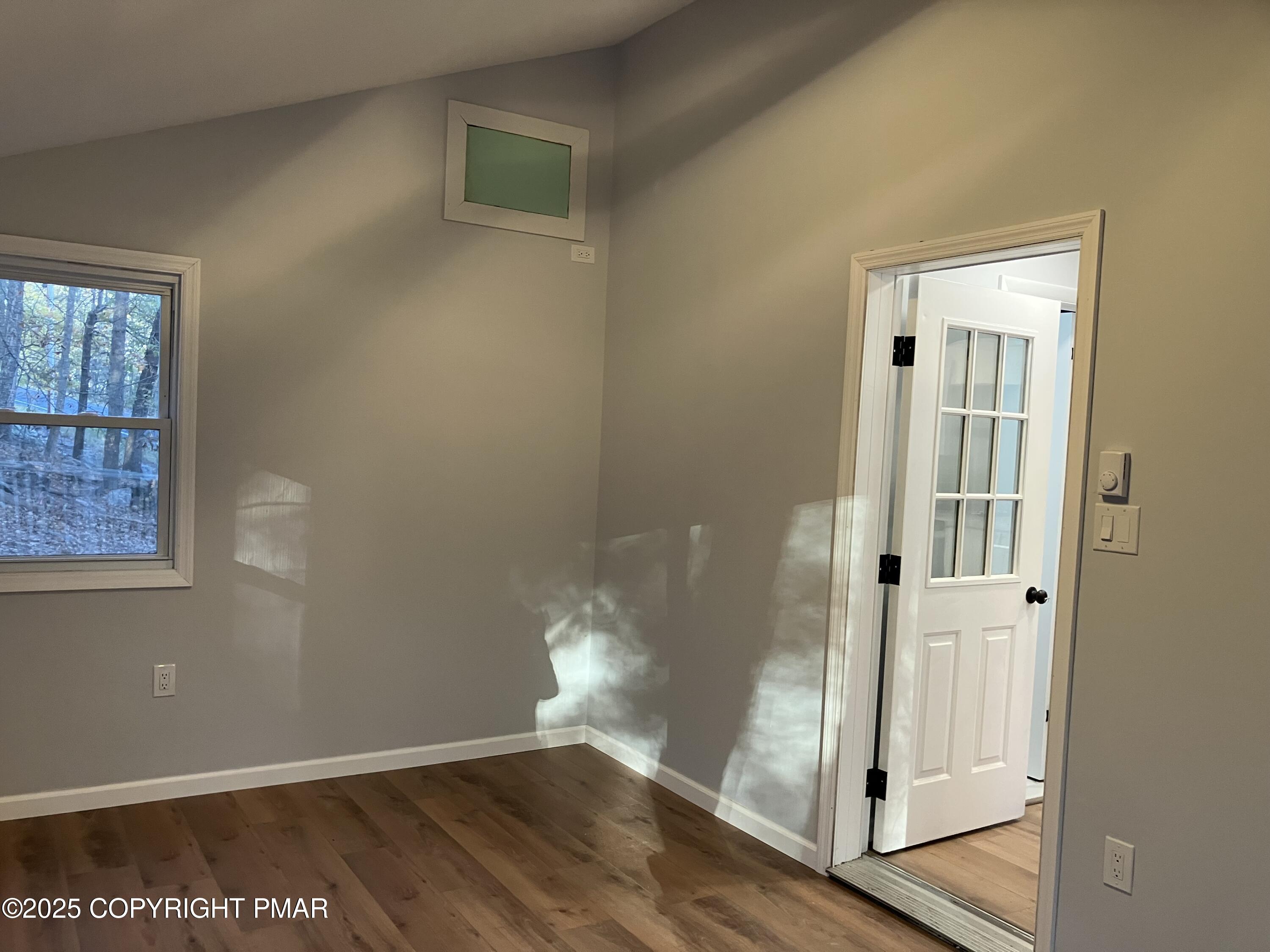 2096 Scarborough Way Bushkill, PA 18324 - Photo 29 of 38 an empty room with wooden floor and entrance