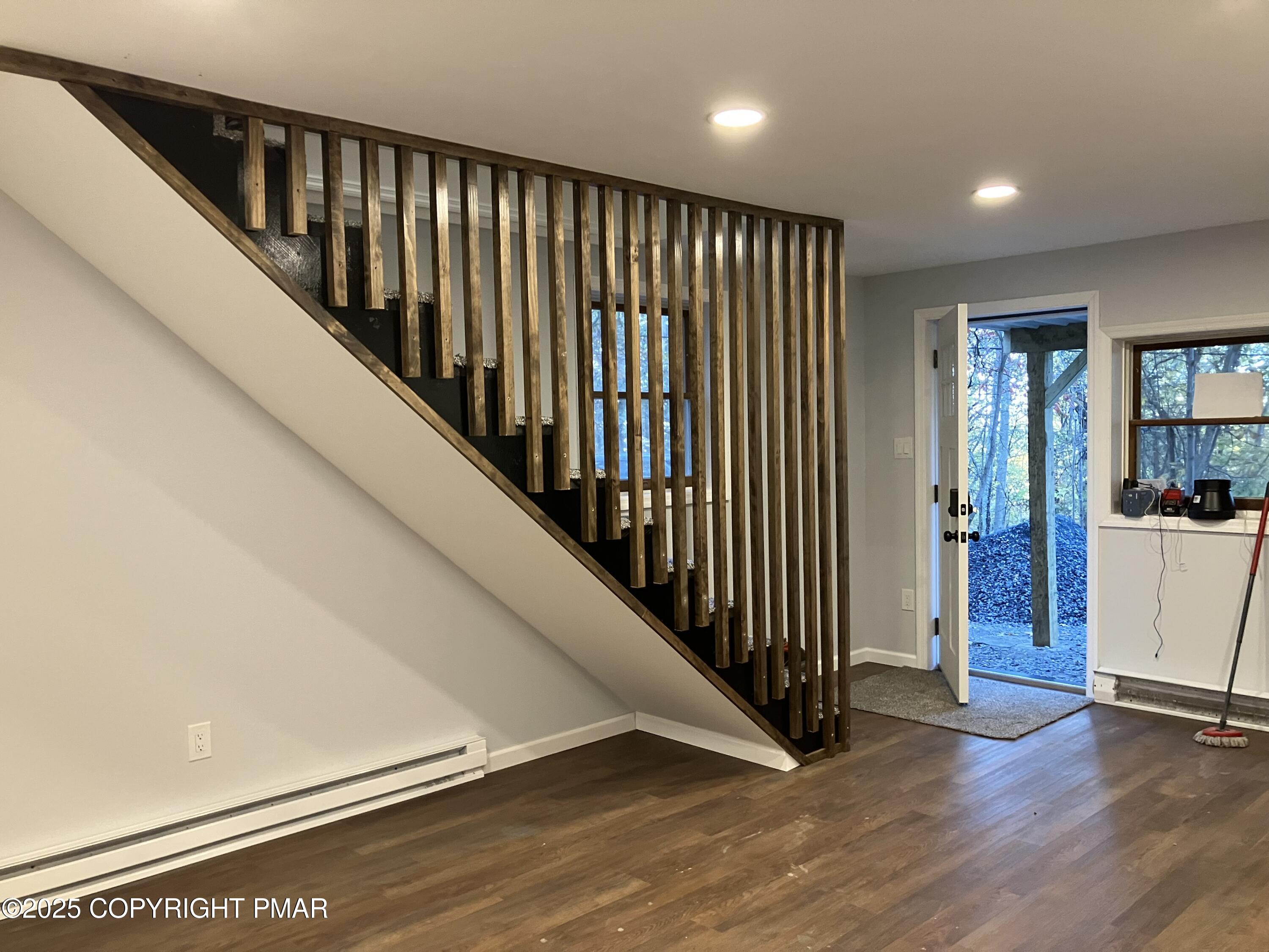 2096 Scarborough Way Bushkill, PA 18324 - Photo 6 of 38 a view of a hallway with wooden floor and stairs